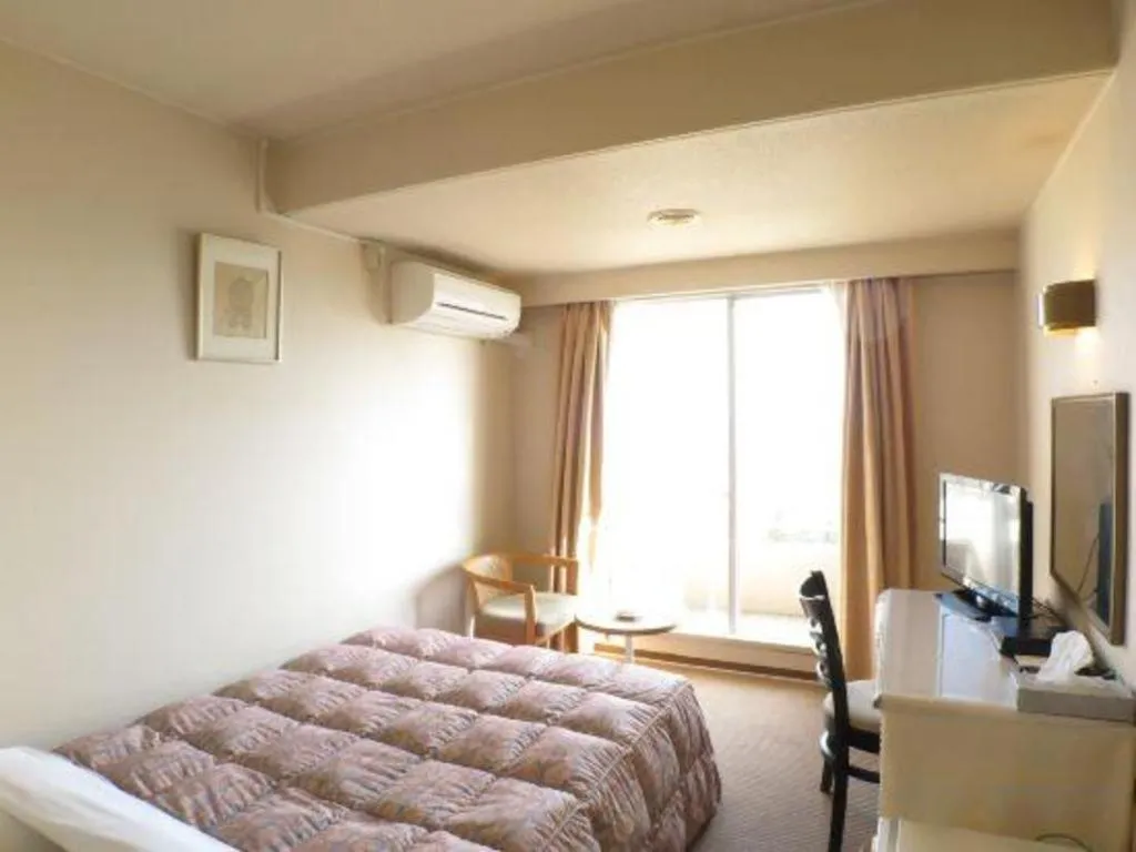 Bed in Hotel Tenchikaku