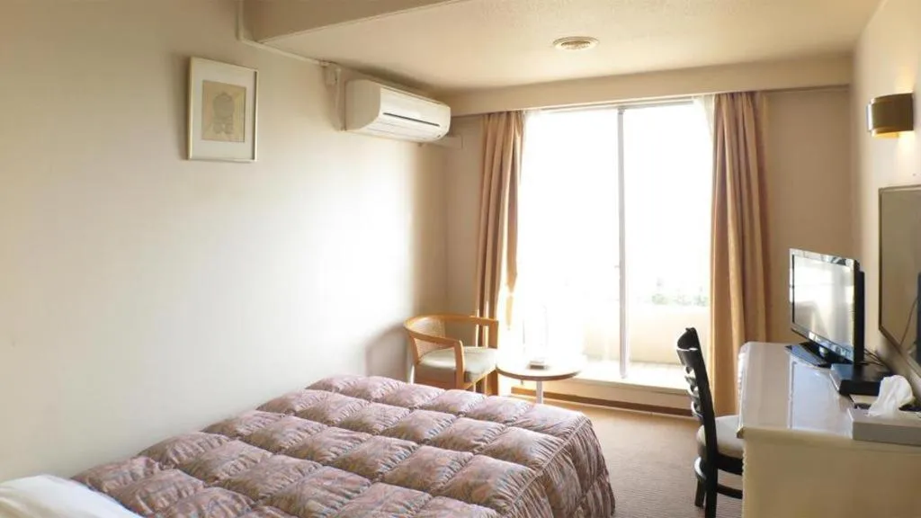 Bed in Hotel Tenchikaku