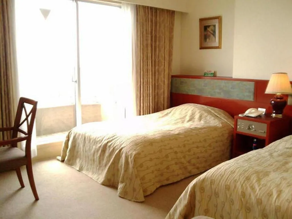 Bed in Hotel Tenchikaku