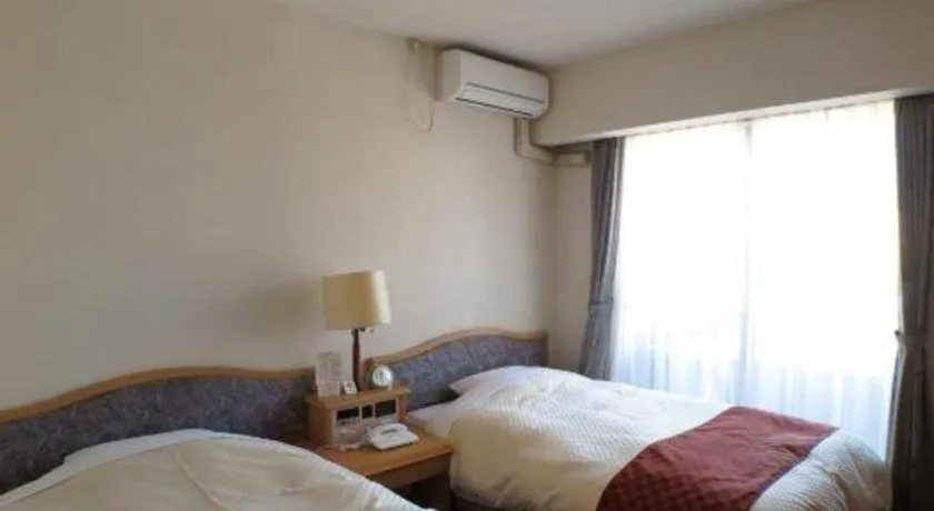 Bed in Hotel Tenchikaku