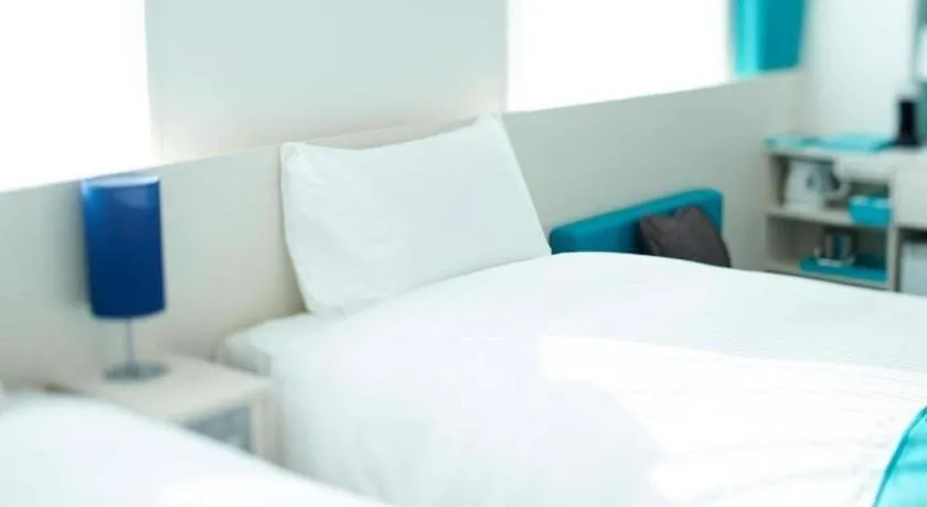 Bed in Daiwa Roynet Hotel OSAKA-SHIN UMEDA ANNEX