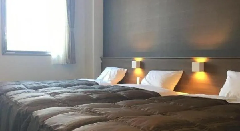 Bed in Daemado Hotel Hitakatsu