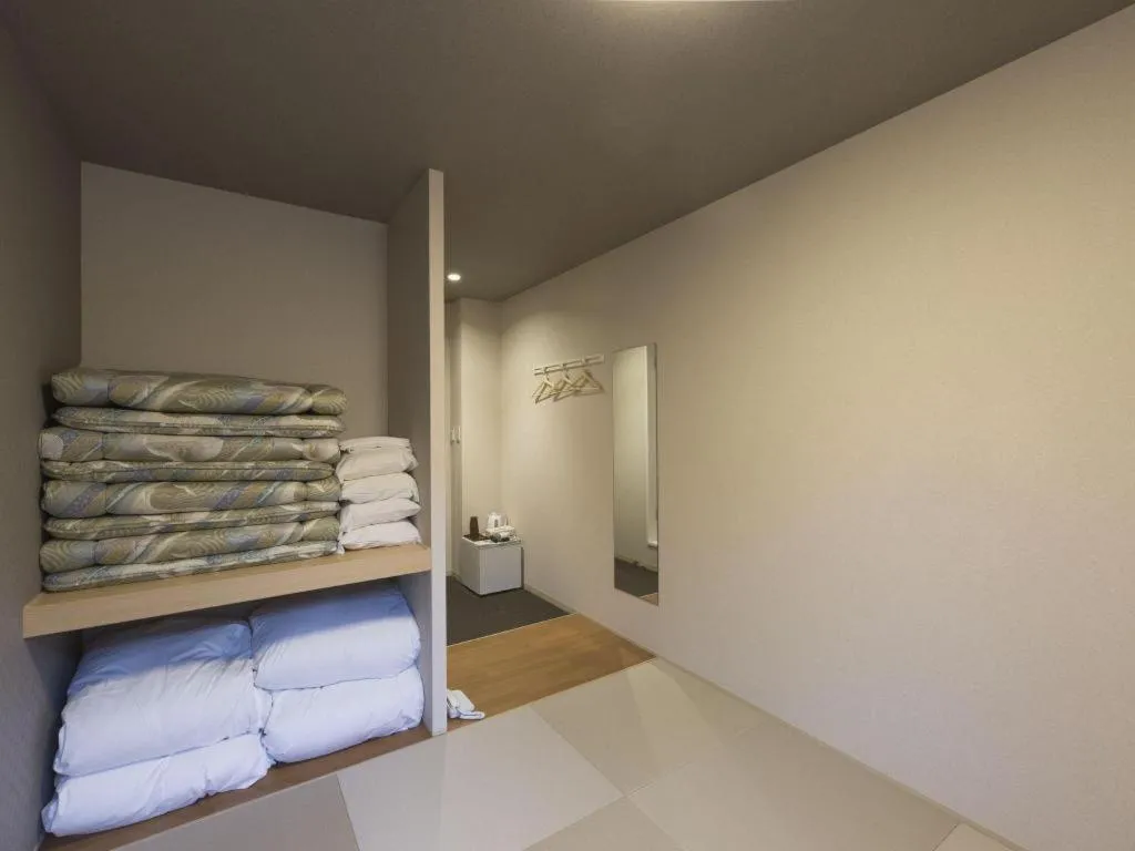 Bed in Daemado Hotel Hitakatsu