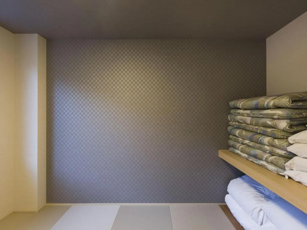 Bed in Daemado Hotel Hitakatsu