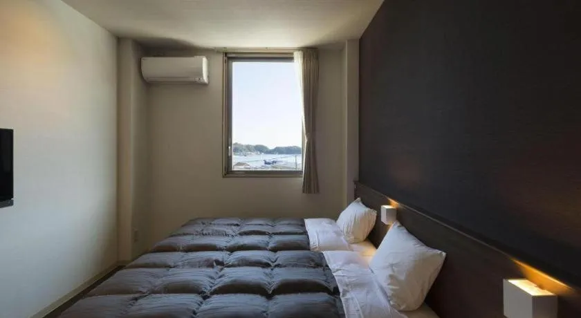 Bed in Daemado Hotel Hitakatsu