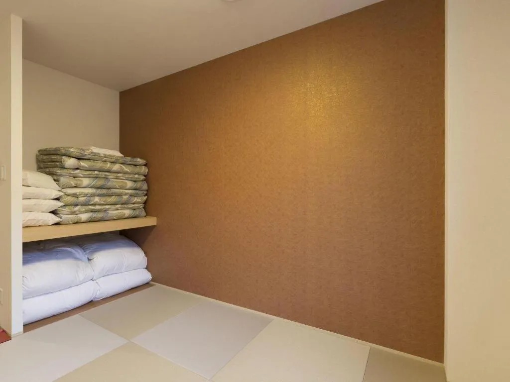 Bed in Daemado Hotel Hitakatsu