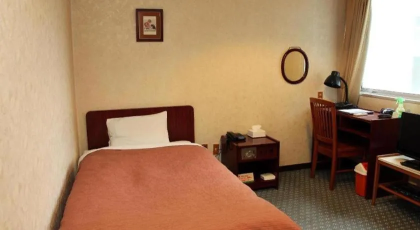 Bed in AKISAWA HOTEL