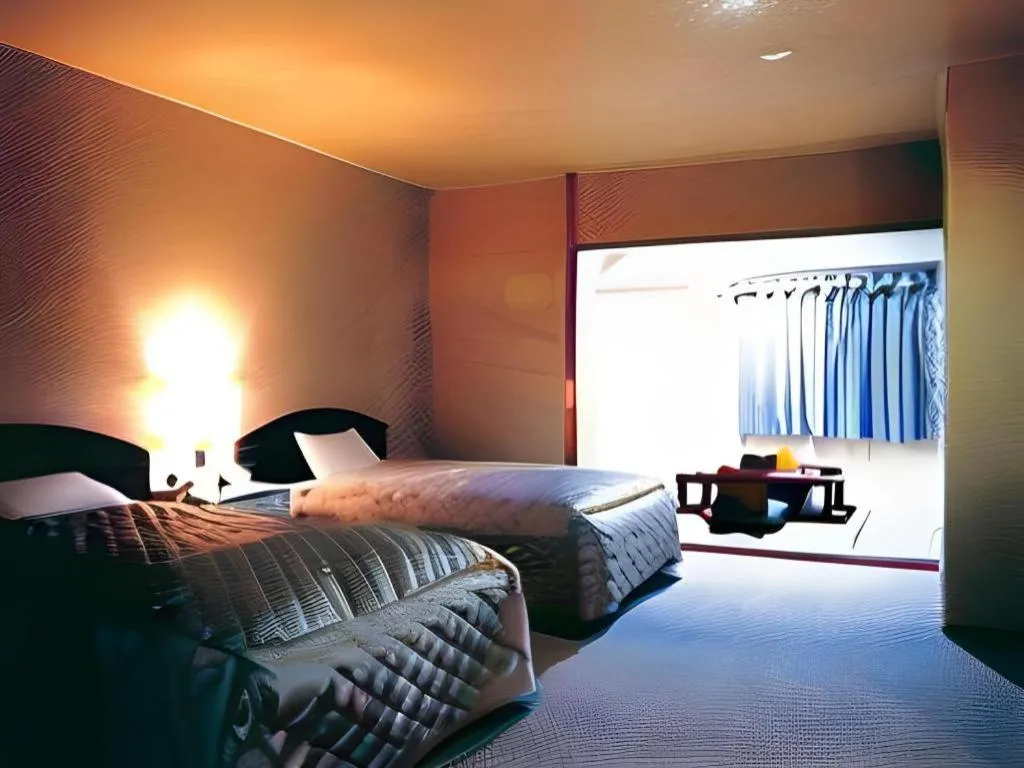 Bed in AKISAWA HOTEL