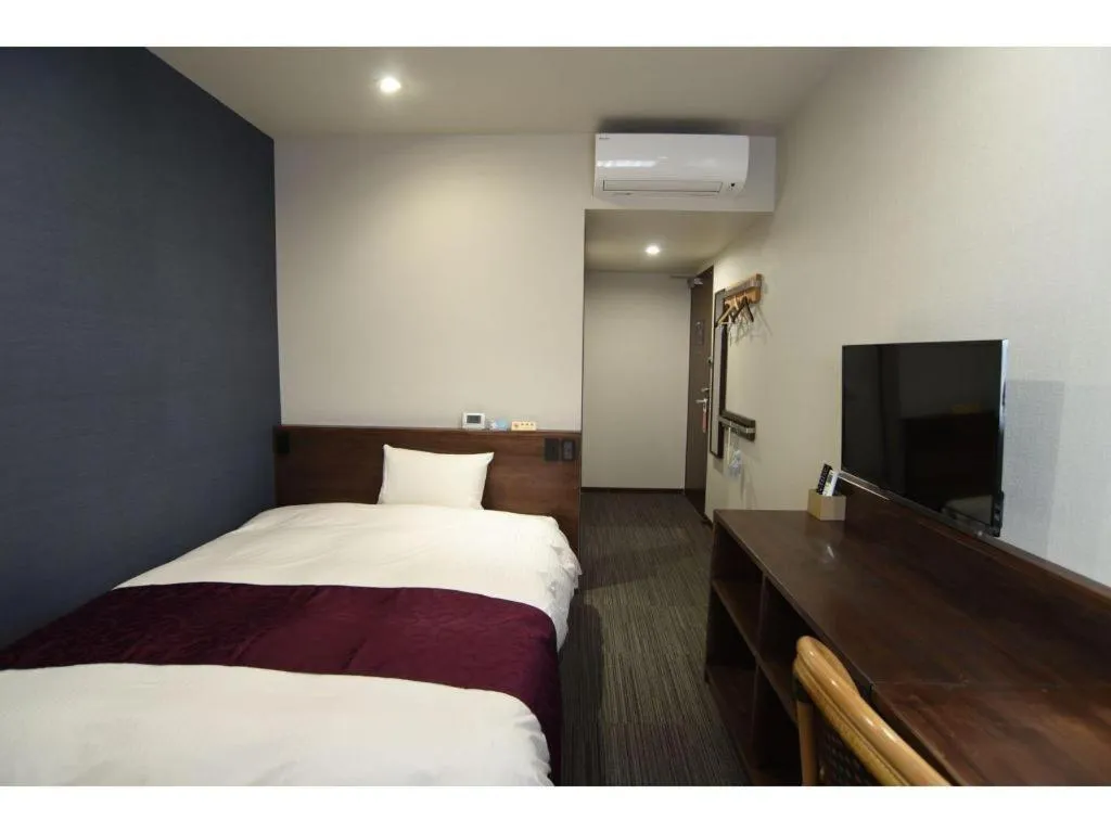 Bed in AKISAWA HOTEL