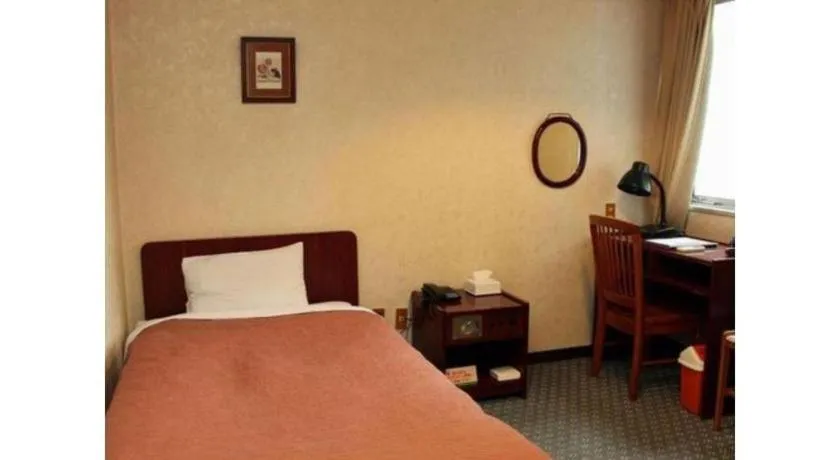 Bed in AKISAWA HOTEL