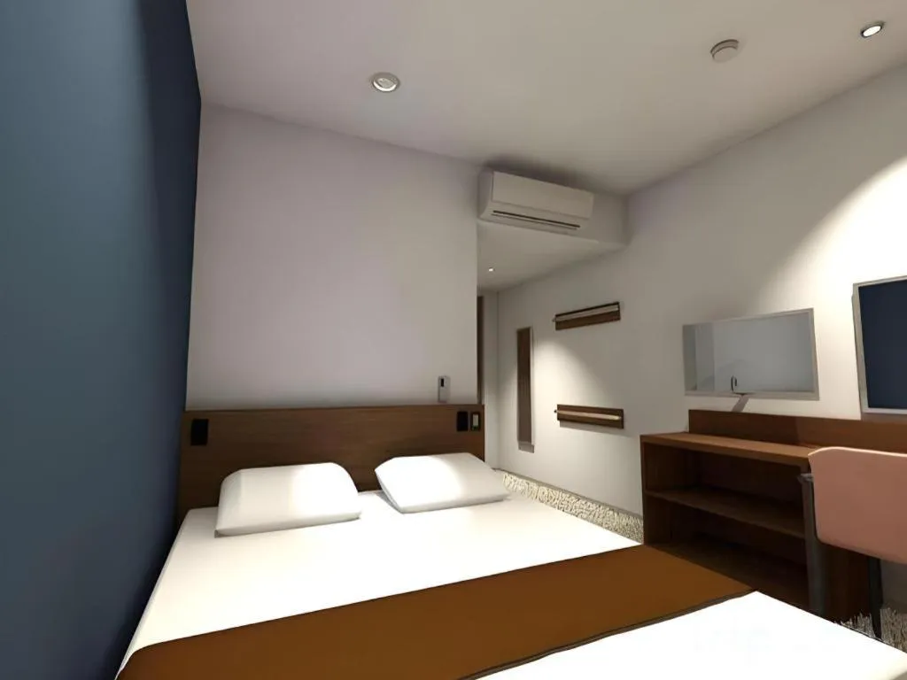 Bed in AKISAWA HOTEL