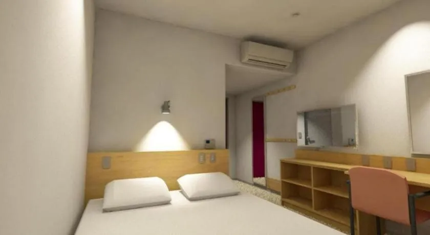 Bed in AKISAWA HOTEL