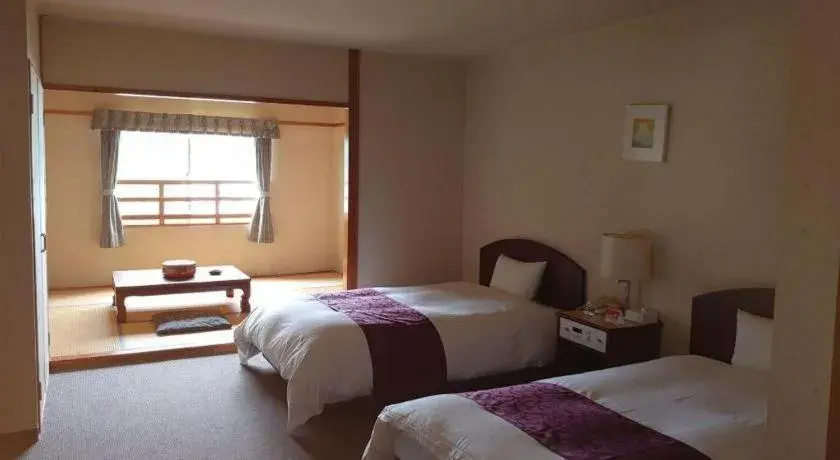 Bed in AKISAWA HOTEL Bed in AKISAWA HOTEL