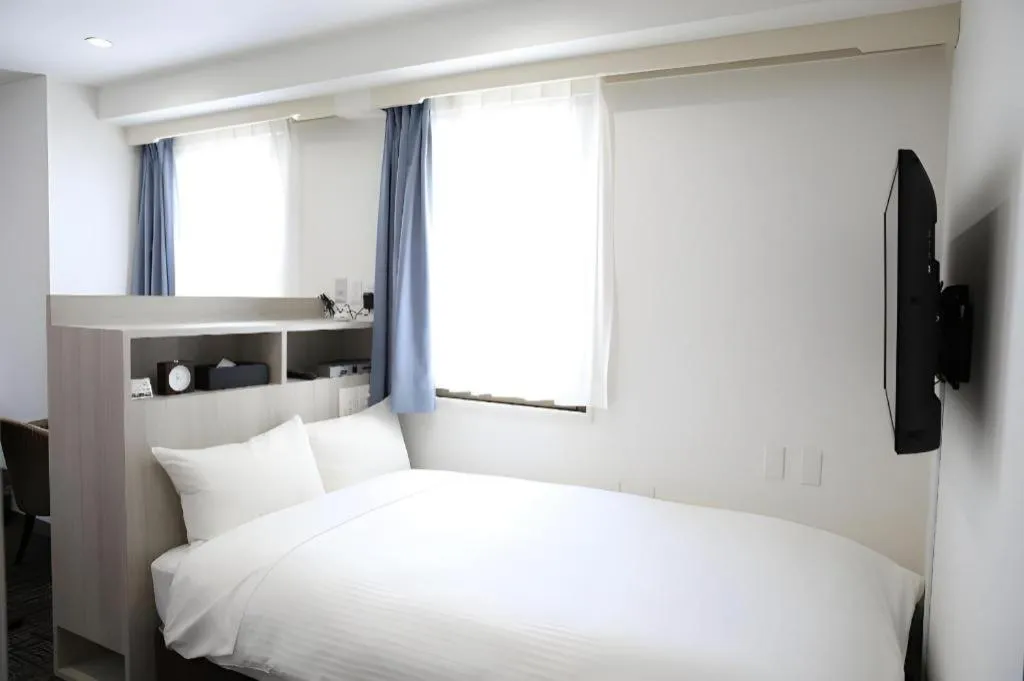 Bed in Hotel Sunshine Iwaki