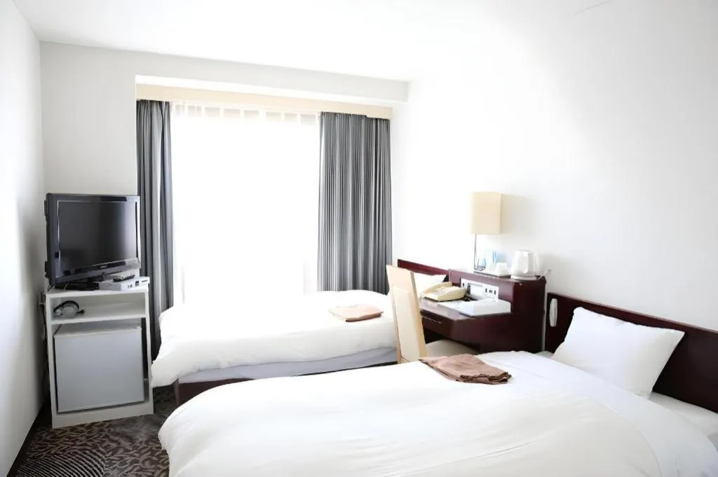 Bed in Hotel Sunshine Iwaki