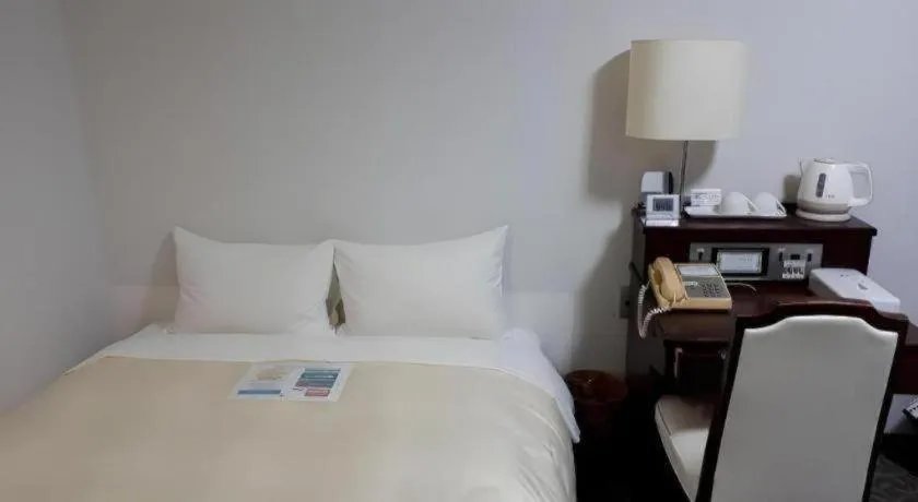 Bed in Hotel Sunshine Iwaki