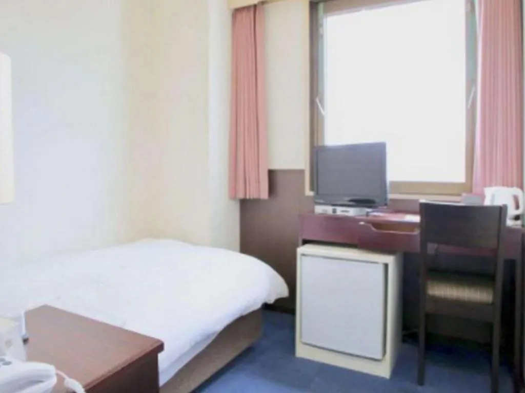 Bed in Hotel Sunshine Iwaki