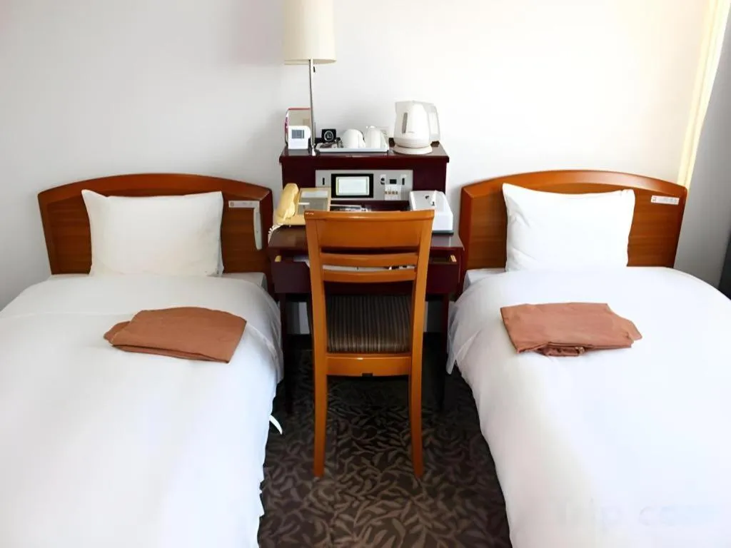 Bed in Hotel Sunshine Iwaki