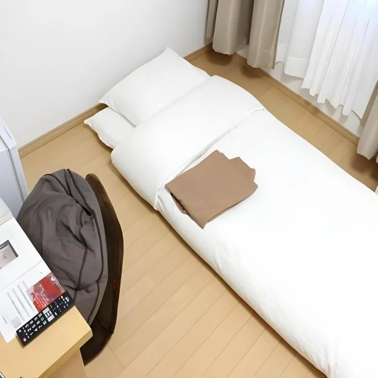 Bed in Hotel Sunshine Iwaki