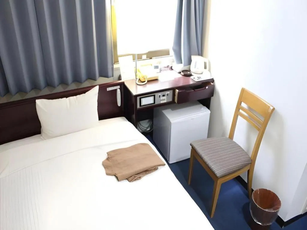 Bed in Hotel Sunshine Iwaki