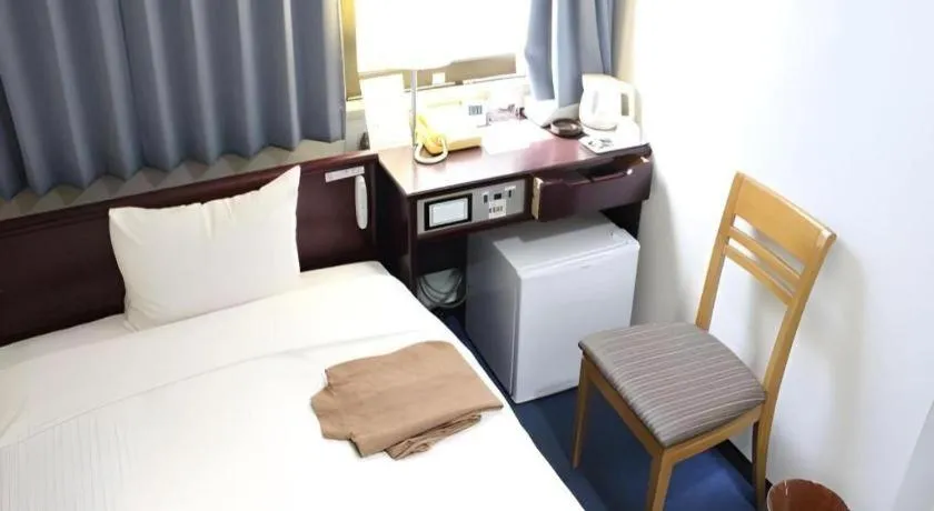 Bed in Hotel Sunshine Iwaki