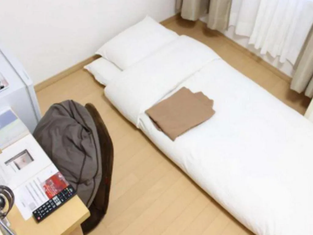 Bed in Hotel Sunshine Iwaki