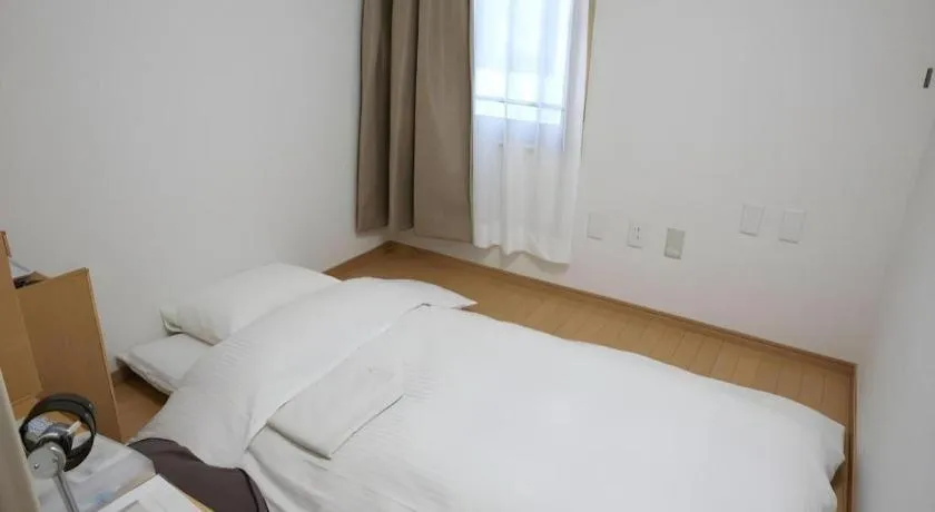 Bed in Hotel Sunshine Iwaki