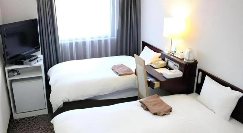 Bed in Hotel Sunshine Iwaki