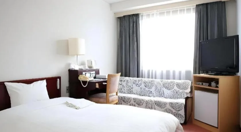 Bed in Hotel Sunshine Iwaki