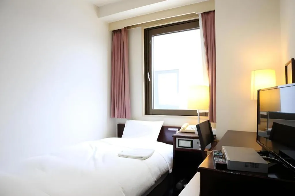 Bed in Hotel Sunshine Iwaki