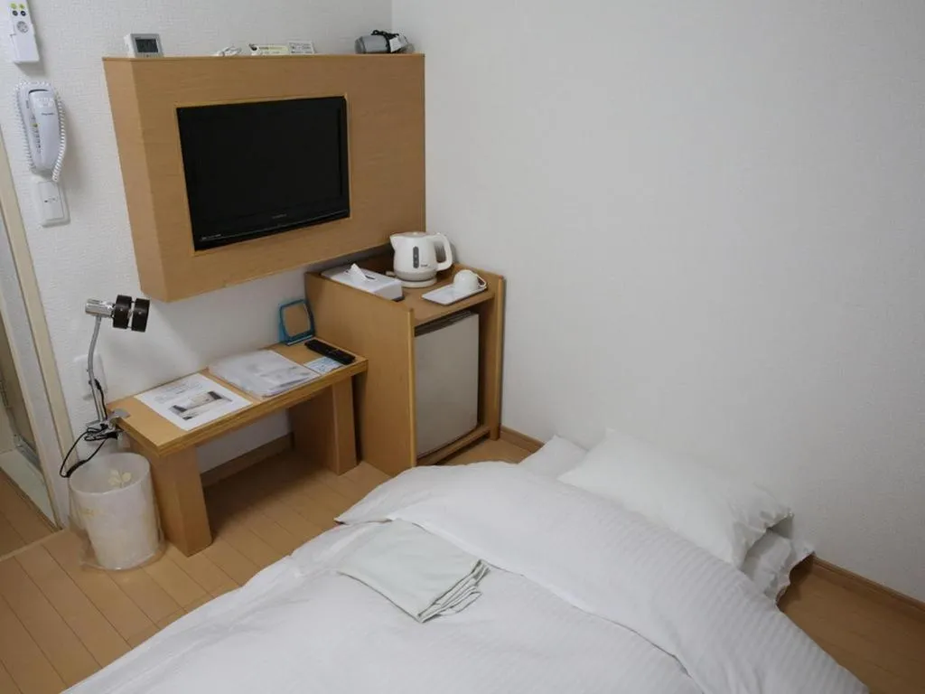 Bed in Hotel Sunshine Iwaki