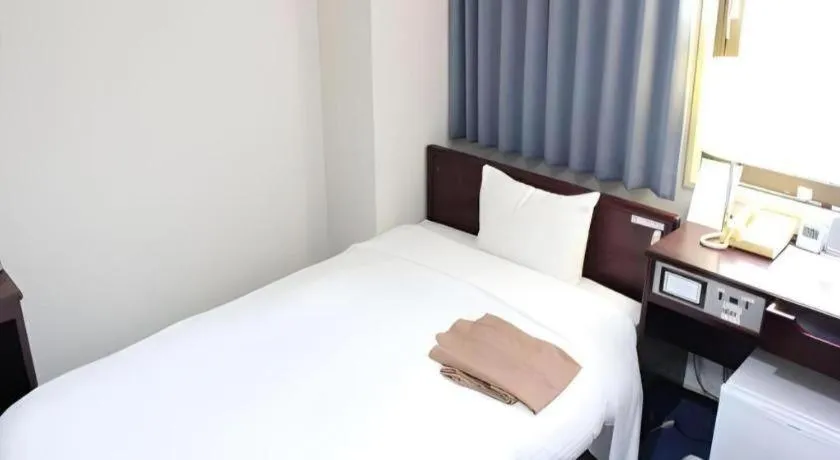 Bed in Hotel Sunshine Iwaki