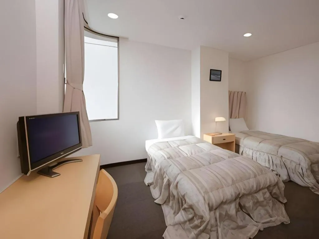 Bed in Hotel Sunshine Iwaki