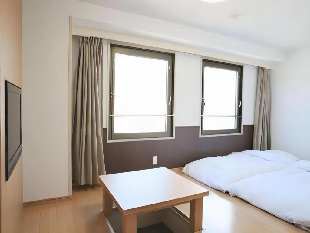 Bed in Hotel Sunshine Iwaki