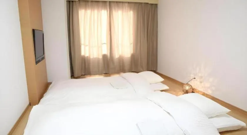 Bed in Hotel Sunshine Iwaki