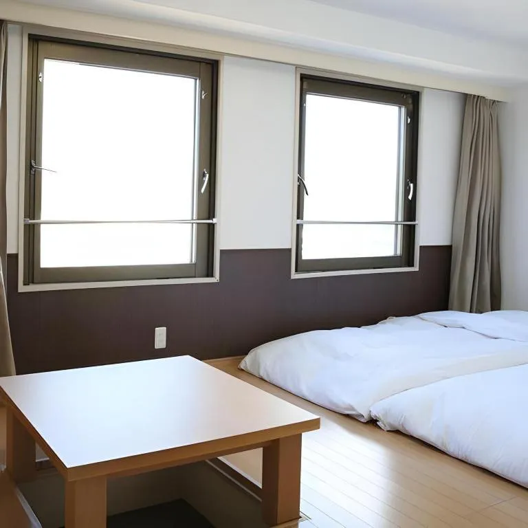 Bed in Hotel Sunshine Iwaki