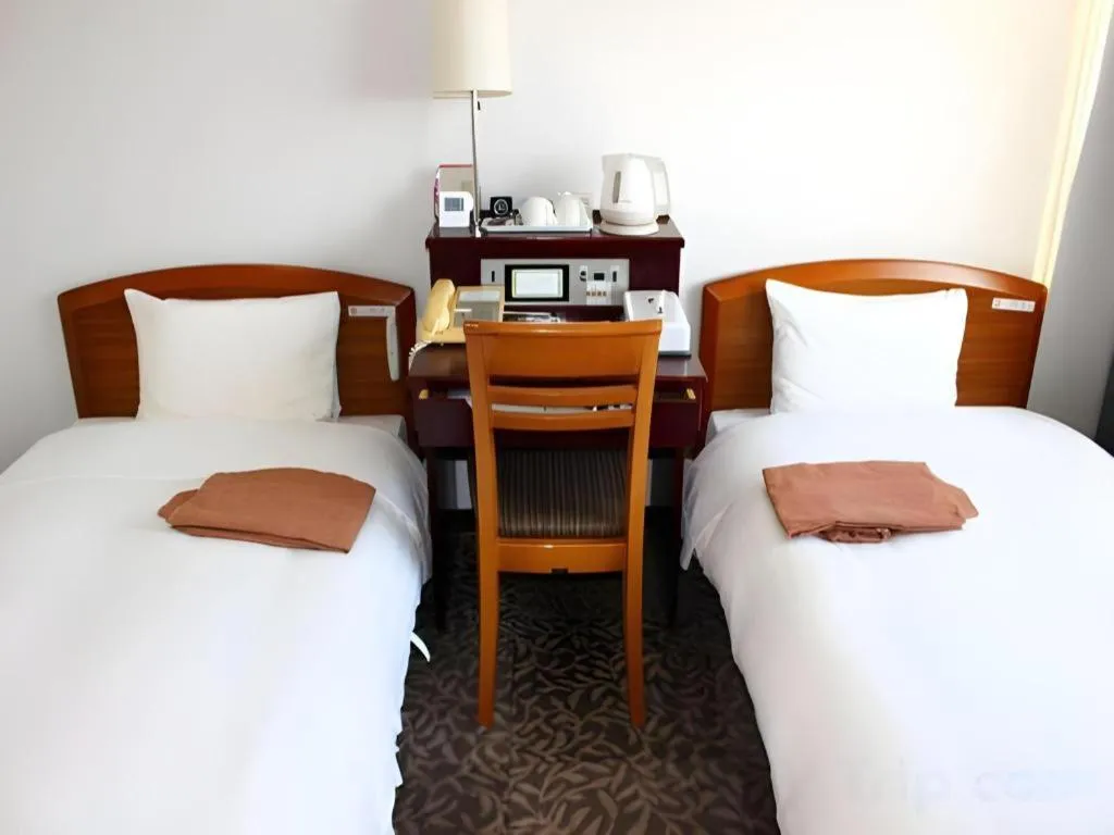 Bed in Hotel Sunshine Iwaki