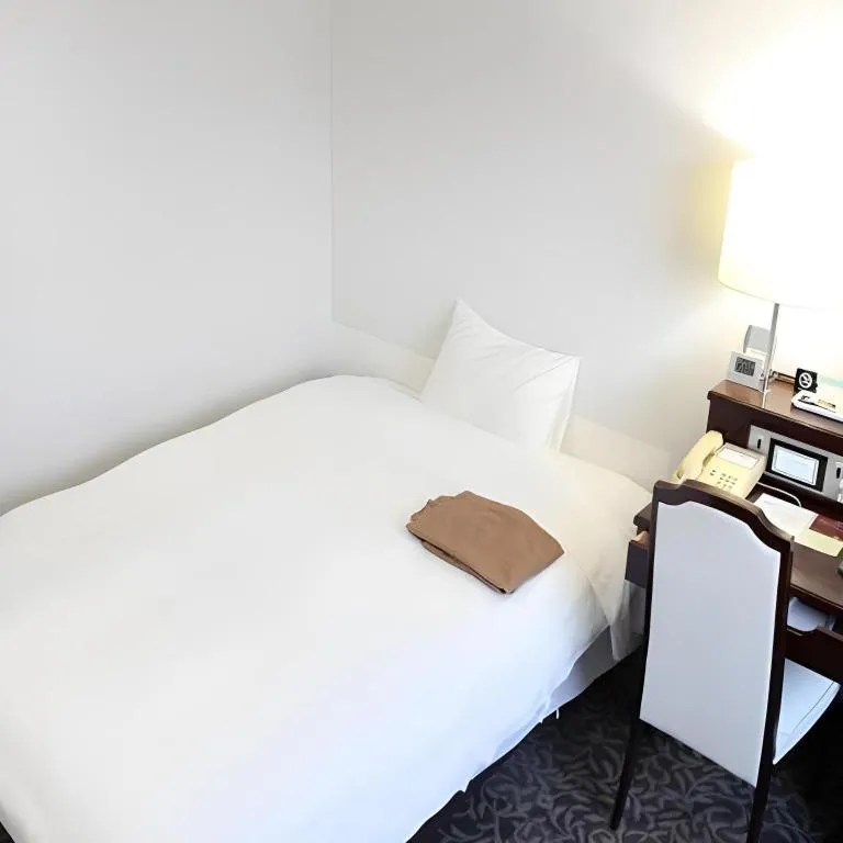 Bed in Hotel Sunshine Iwaki