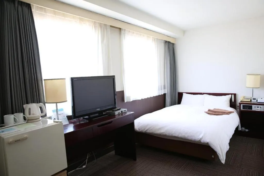 Bed in Hotel Sunshine Iwaki