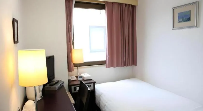 Bed in Hotel Sunshine Iwaki