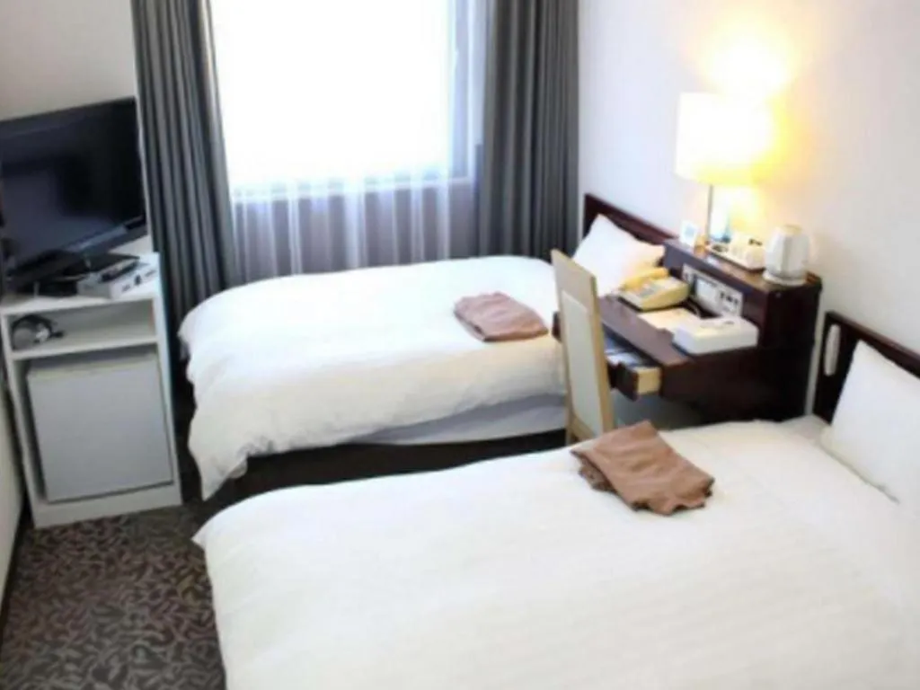 Bed in Hotel Sunshine Iwaki