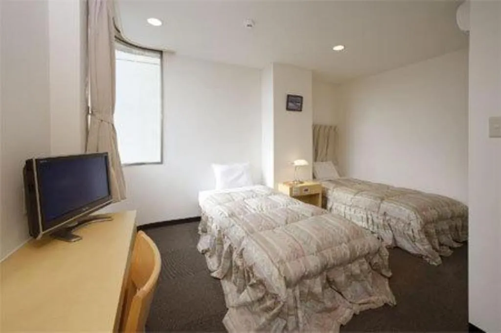 Bed in Hotel Sunshine Iwaki