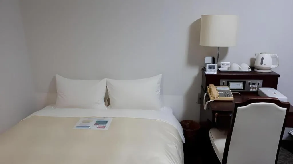 Bed in Hotel Sunshine Iwaki