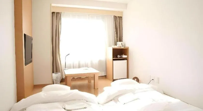 Bed in Hotel Sunshine Iwaki