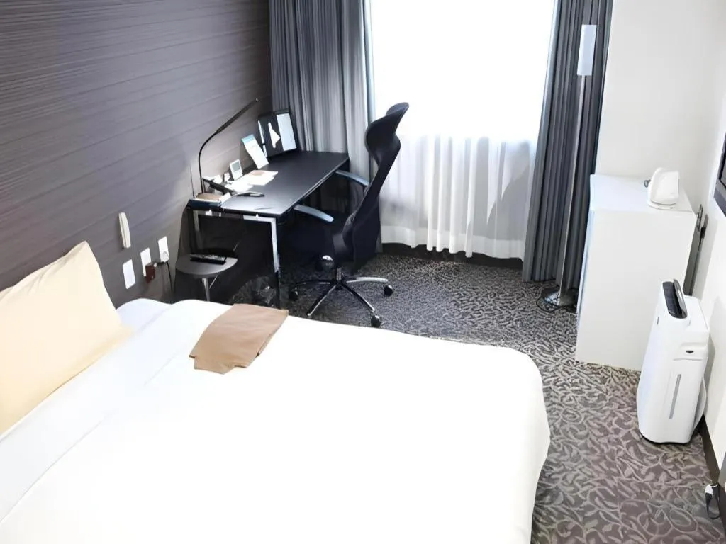 Bed in Hotel Sunshine Iwaki
