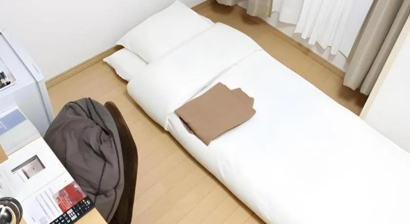 Bed in Hotel Sunshine Iwaki