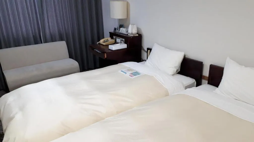 Bed in Hotel Sunshine Iwaki