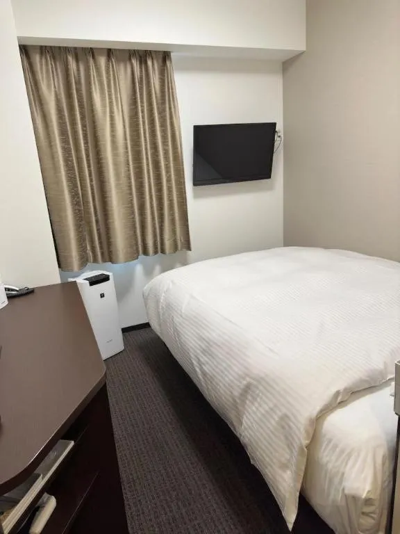 Bed in E Hotel Kumagaya Annex