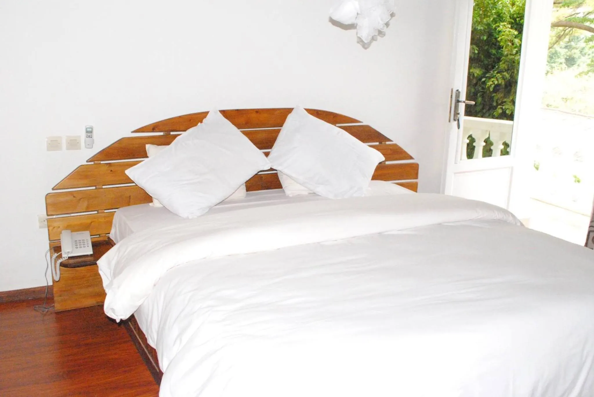 Bed in Kiriri Residence Hotel