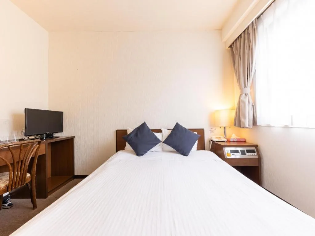 Bed in Tabist Yabuki Station Hotel